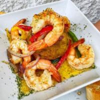 Sweet Plantain Mofongo with Shrimp (Mofongo de Platano Maduro con Camarones) · Deep-fried sweet plantain mashed with garlic, salt, broth, butter, and shrimp in tomato-base...