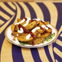 Patatas Buenas · Baked potato wedges topped with our Spicy Sauce and Flower Mayo.