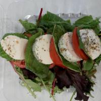 Caprese Salad · Fresh mozzarella, tomato and basil.