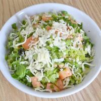 Chopped Salad · Romaine and iceberg lettuce, tomato, onions, black olives, cucumbers, garbanzo beans and moz...