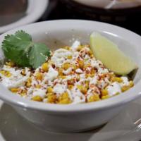 Ezquite · Mexican street corn served with mayonnaise, queso fresco, lime and chile, it’s creamy and in...