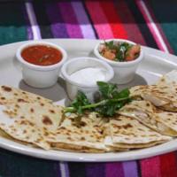 Quesadilla Santa Fe Appetizer · 2 flour tortillas grilled, filled with melted cheese and your choice of grilled chicken or s...