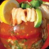Cocktail de Camarones · Mexican-style cocktail over a dozen shrimp, prepared with special juice, pico de gallo, slic...