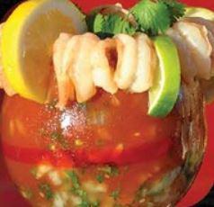 Cocktail de Camarones · Mexican-style cocktail over a dozen shrimp, prepared with special juice, pico de gallo, slices of avocado and lime juice.