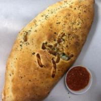 Chicken Parm Calzone · Fried Chicken Tenders, Red Sauce, Shredded Mozzarella Cheese,, Parmesan Cheese, Fresh Herbs