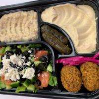 Vegetarian Plate Specialty · Mix of Mediterranean vegetarian hummus, salad, 2 pieces of dolma, 2 pieces of falafel, and 2...