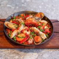 Paella del Sur · Serves for 1-2 people. Scallops, market fish, calamari, shrimp, and saffron rice.