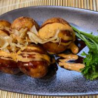 Takoyaki · 6 pieces. Fried octopus ball with special sauce on top.