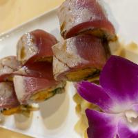 Rising Sun Roll · Spicy shrimp and cucumber inside with seared tuna on top.