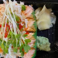 Emperor Roll · Spicy kani, cucumber, avocado inside with salmon, crunchy, crab meat, tobiko, radish
sprouts...
