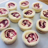  Strawberry Swirl Cheesecake Minis  · Fresh, sweet strawberry compote swirled  through our classic cheesecake. Baked on our from-s...