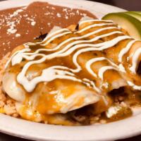 Mexican Enchilada · Soft tortilla served with your choice of meat, topped with mild hot sauce, fried beans, chee...