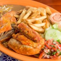 Fried Chicken · Pollo frito served with rice, beans, fries and salad.