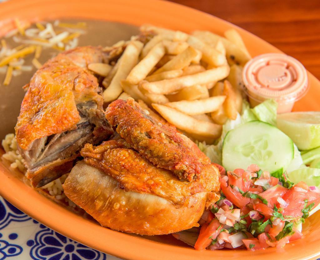 Fried Chicken · Pollo frito served with rice, beans, fries and salad.