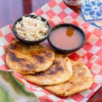 Pupusas · Homemade tortillas filled with cheese, pork or beans filled with cheese.