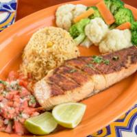 Grilled Salmon · Salmon con vegetables. 8 oz. grilled salmon served with vegetables and rice.