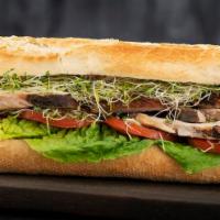 Pork Sandwich · French baguette filled with 1/2 pound of pork, fresh tomato, lettuce and alfalfa.