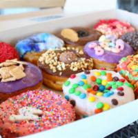 Dozen Baker's Choice Assorted Gourmet · Let us pick our favorite donuts. You can also type in  specific donuts and we'll substitute ...