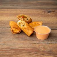 SOUTHWEST EGGROLLS · Deep-fried crispy rolls packed with cheese, corn, seasoned black bean and chicken.