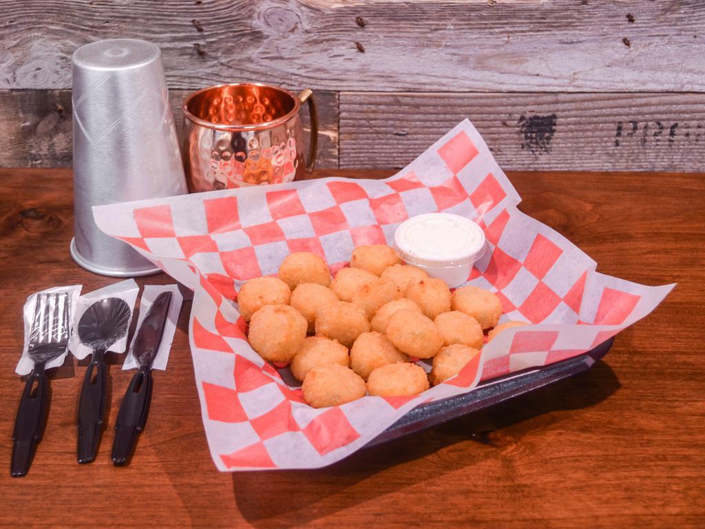 Jalapeno Cheese Tots · These Cheese Tots are filled with a hint of Jalapeno and gooey cheddar/american cheese. Served with our queso for and amazing pop!