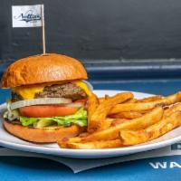 Nellie Burger · 6 oz. Handcrafted, house seasoned, Angus patty on a brioche bun served with French fries. ( ...