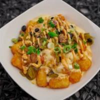 South of the Border Tots · Tots with signature loaded queso with tomato, green chilis, onion, black beans, jalapenos, a...
