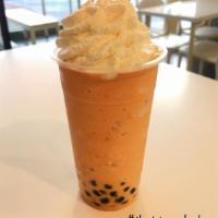 Thai Tea Frozen Blend · Using our premium flavor / powder base blended with milk & ice topped with whipped cream.