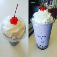 Taro Frozen Blend · Using our premium flavor / powder base blended with milk & ice topped with whipped cream.