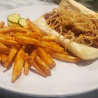BBQ Pulled Pork Sandwich · Topped with onions straws.