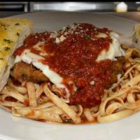Chicken Parmesan on Fettuccine · Lightly breaded chicken with homemade marinara sauce and melted mozzarella cheese with garli...