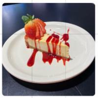 NY Style Cheese Cake · Cheesecake with a strawberry drizzle.