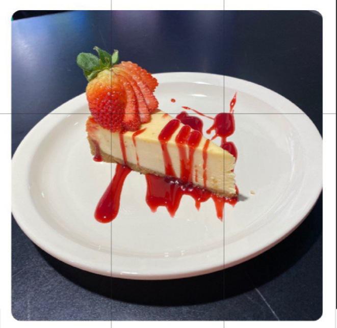 NY Style Cheese Cake · Cheesecake with a strawberry drizzle.