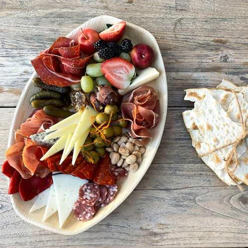 Europa Village Charcuterie  · Selection of Iberico Ham and cured meats, assorted Spanish regional cheeses, seasonal fruit and vegetables, honey, nuts, olives, and gourmet crackers.