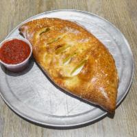 Veggie Calzone · Green peppers, onions, black olives, mushrooms, and tomatoes.