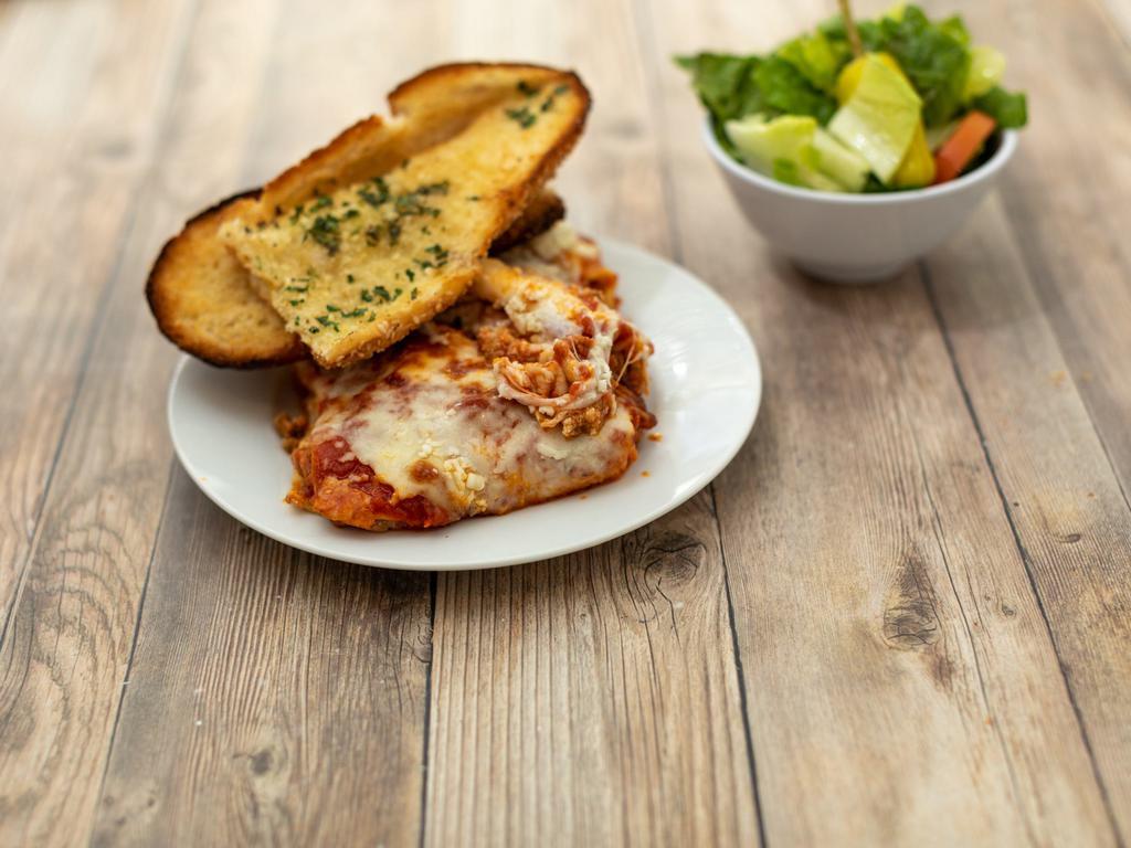 Lasagna · Lasagna topped with classic cheese, tomato sauce, and ground beef. 