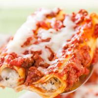 Baked Manicotti · A large tube of fresh pasta stuffed with a blend of soft cheese. 