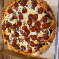 De Lucas Special Pizza · Mushrooms, onions, pepperoni, black olives, Canadian bacon, sausage, and green peppers.