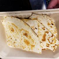 Cheese Quesadilla · Cooked tortilla that is filled with cheese and folded in 1/2. 