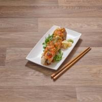 Dragon Roll · Tempura shrimp, imitation crab meat, topped with unagi, avocado, tobiko and sesame with unag...