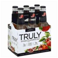 Truly Spiked and Sparkling Sparkling Water, Spiked, with a Hint of Pomegranate - 6 Pack · Net wt 4.96 lb.