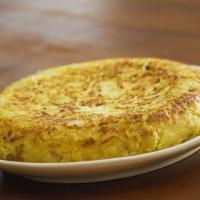 Tortilla Espanola · Traditional egg, potato and onion omelette grandma's recipe. Tortilla tradicional de huevos,...