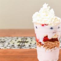 Bonjour · Layers of straberry yogurt, sliced banana, mango, strawberry, blueberries, granola topped of...