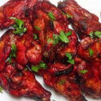 Tandoori Wings (6 pcs) · Chicken Wings marinated in yogurt, house spices and cooked in a clay oven.