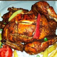 Tandoori (Whole Chicken) · Whole chicken marinated in yogurt, house spices and cooked in a clay oven.