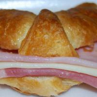 Medialuna with Ham and Cheese Sandwich · Mini croissant, ham and cheese toasted.