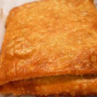 Pizza Puff · Fried and stuffed pizza pocket. 