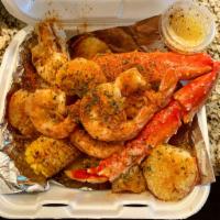 King Crab and Shrimp Plate · 1/2 pound of king crab and jumbo shrimp with 2 sides.