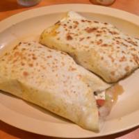 5. Super Quesadilla · flour tortilla topped with cheese and salsa, sour cream, guacamole choice of meat 