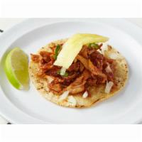 Al Pastor Taco · The ultimate Mexico City street taco. Thinly sliced, marinated heritage pork served with cil...