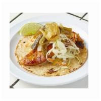 Seared Fish Taco · Marinated, sustainably caught Alaskan cod seared Yucatan-style. Cabbage, spicy escabeche & d...